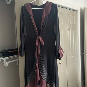 Unique long sweater . Gray with burgundy accent . Size medium .